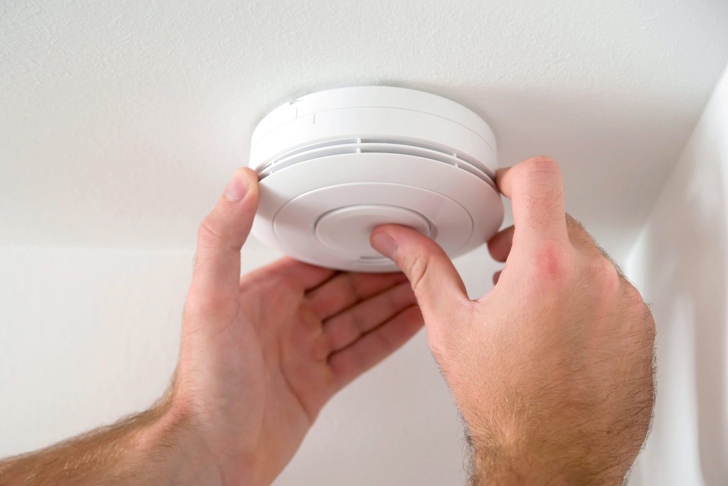 Smoke alarms being adapted